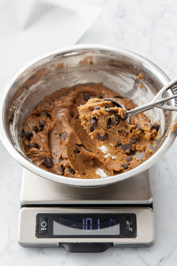 Scooping dough into large 100 gram balls.