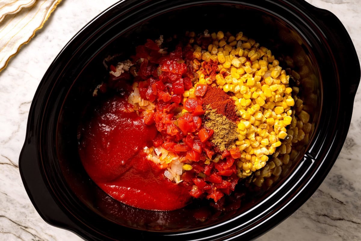 Turkey chili ingredients combined in the crock pot.